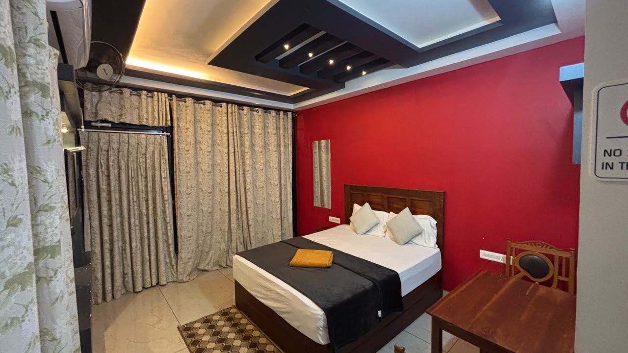 Bedroom with a double bed and seating